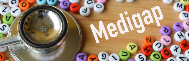 A stethoscope placed among colorful letter beads with the word "Medigap" prominently displayed.