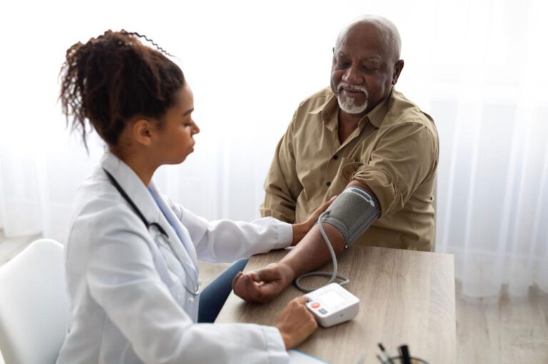 A doctor administering a blood pressure test to a patient.