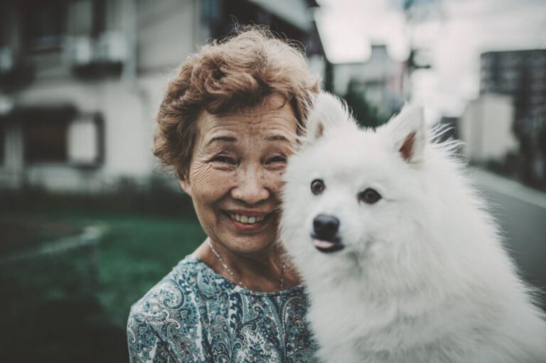 Smiling woman with a dog.