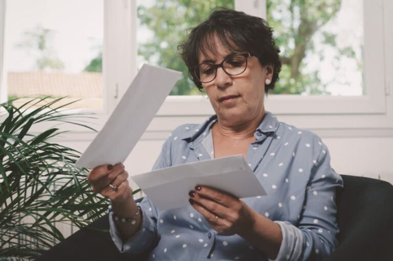 Woman looking at mail.