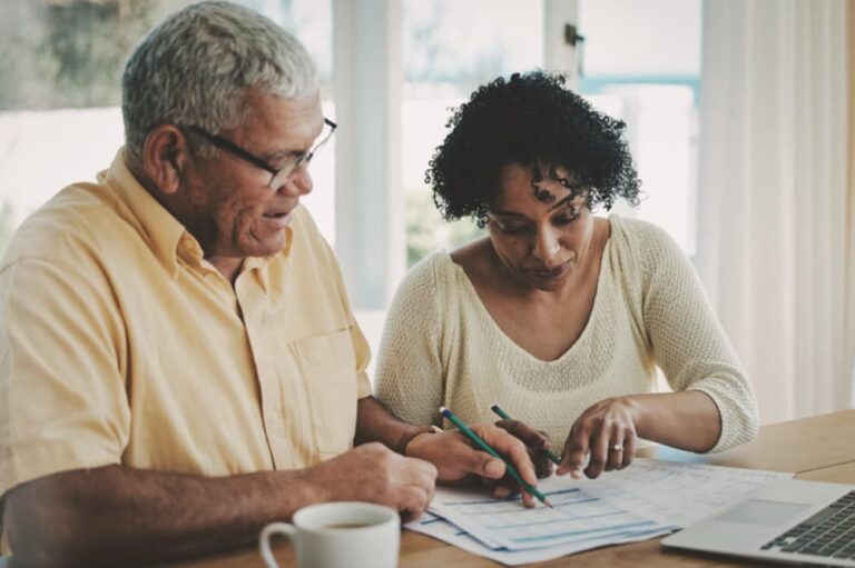 Man and woman looking over paperwork