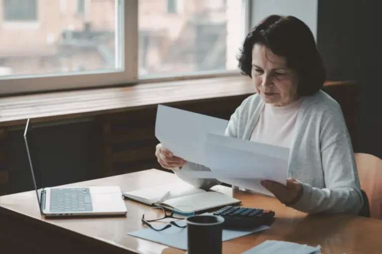 Woman comparing multiple life insurance policies.