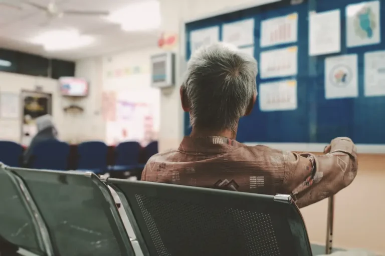 Woman in waiting room to receive care, which could be affected by the Trump administration Medicaid changes.